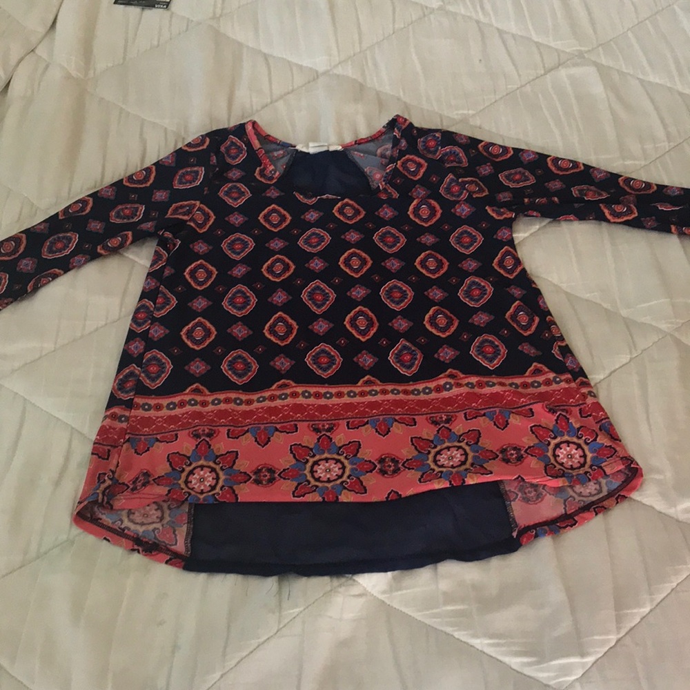 Love spell shirt with murals on it